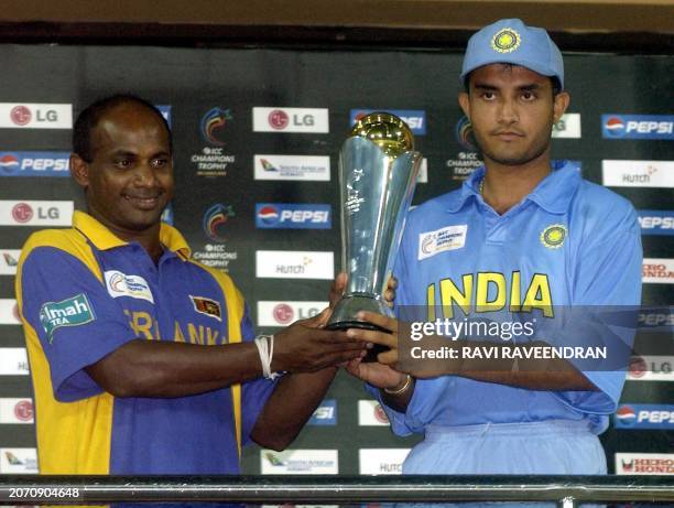 Sri Lankan captain Sanath Jayasuriya and indian captain Sourav Ganguly hold the ICC Champion Trophy during the presentation ceremony in Colombo 30...