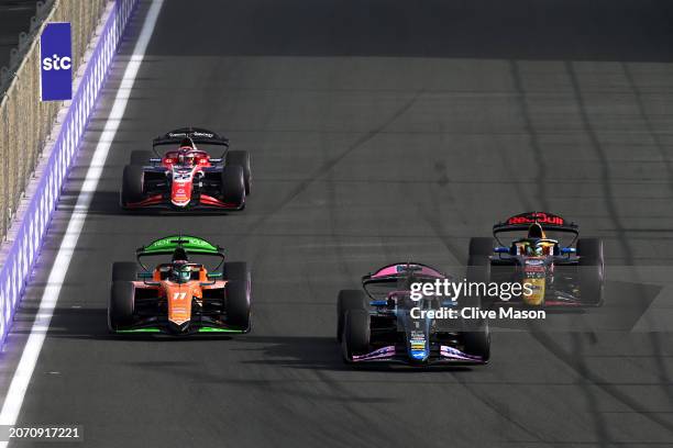 Victor Martins of France and ART Grand Prix leads Dennis Hauger of Norway and MP Motorsport and Isack Hadjar of France and Campos Racing during the...