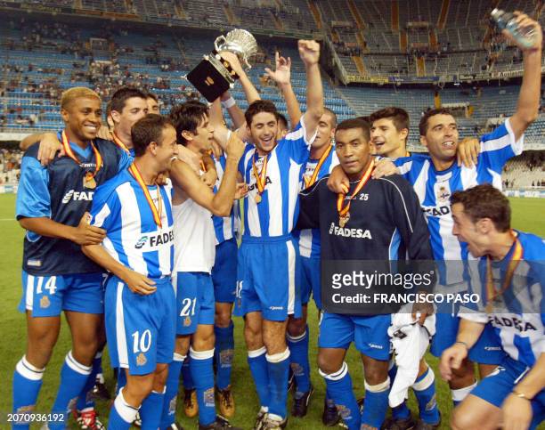 Deportivo Coruna's players celebrate 25 August 2002 the "Supercopa de Espana" in Mestalla Stadium of Valencia in the second match. Depor won it's...