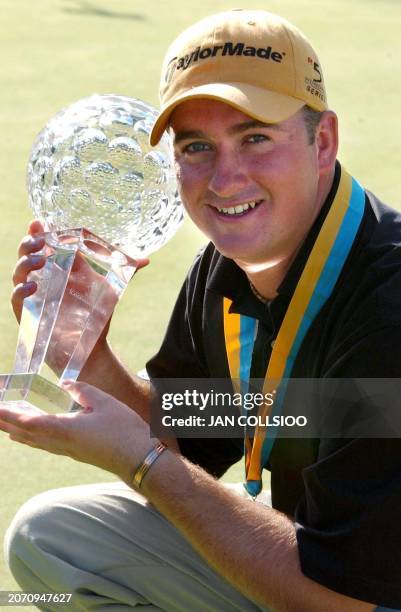 Graeme McDowell of Northern Ireland poses with the trophy after winning The Volvo Scandinavian Masters at Kungsangen Golf Club in Stockholm, 04...