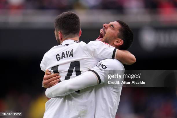 Cenk Ozkacar and Jose Luis Gaya celebrates following the team's victory in the LaLiga EA Sports match between Valencia CF and Getafe CF at Estadio...