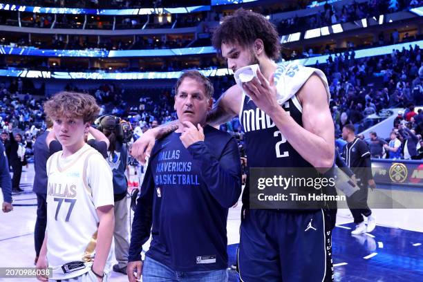 Dallas Maverick owner Mark Cuban walks off the court with Dereck Lively II of the Dallas Mavericks after the game against the Miami Heat at American...