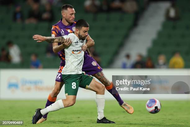 Aleksandar Susnjar of the Glory and Apostolos Stamatelopoulos of the Jets contest for the ball during the A-League Men round 20 match between Perth...