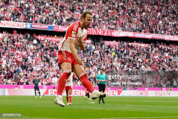 Harry Kane of Bayern Munich celebrates scoring his team's third goal during the Bundesliga match between FC Bayern München and 1. FSV Mainz 05 at...