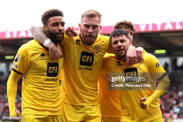 Gustavo Hamer of Sheffield United celebrates scoring his team's first goal with teammates Jayden Bogle and Oliver McBurnie of Sheffield United during...