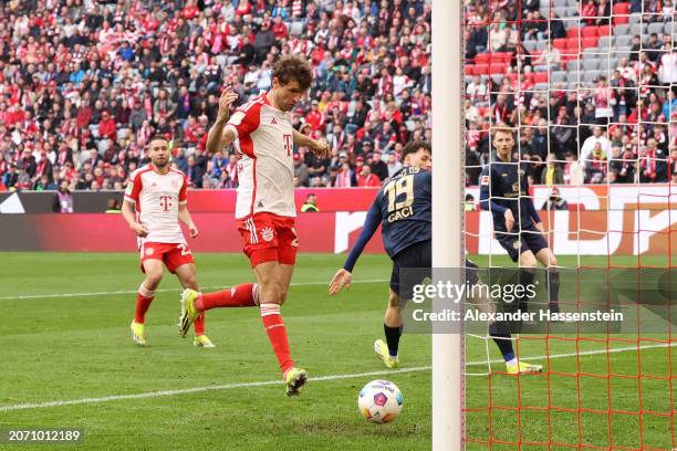 Thomas Mueller of Bayern Munich scores his team's fourth goal during the Bundesliga match between FC Bayern München and 1. FSV Mainz 05 at Allianz...