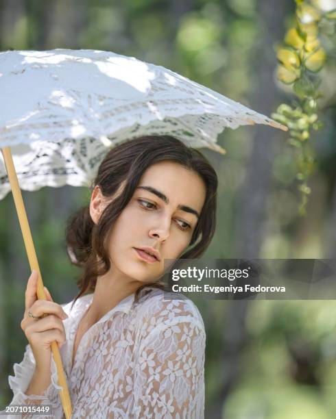 close-up portrait of a girl under a lace umbrella - bali women tradition head stock pictures, royalty-free photos & images