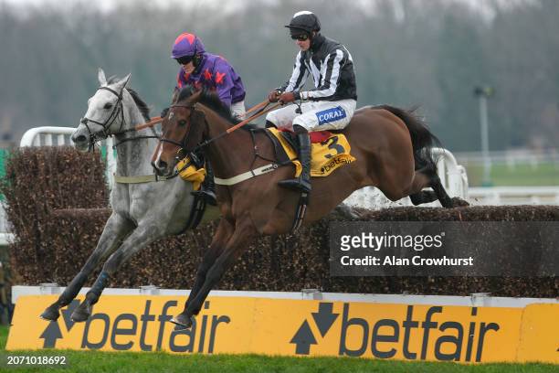 Brendan Powell riding Scarface clear the last to win The Betfair Serial Winners Fund Novices' Handicap Chase at Sandown Park Racecourse on March 09,...