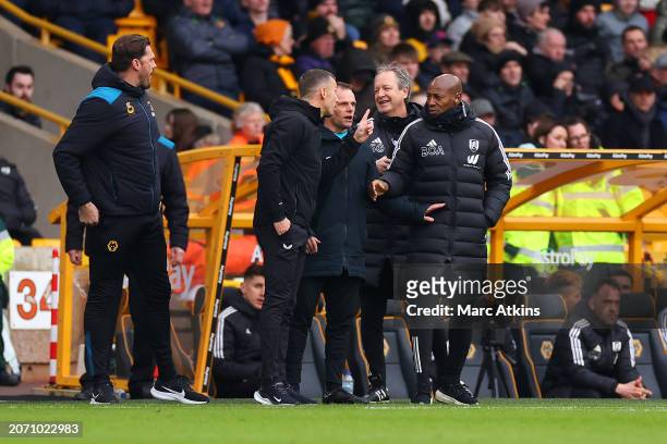 Gary O'Neil, Manager of Wolverhampton Wanderers, and Luis Boa Morte, First Team Coach of Fulham, clash during the Premier League match between...