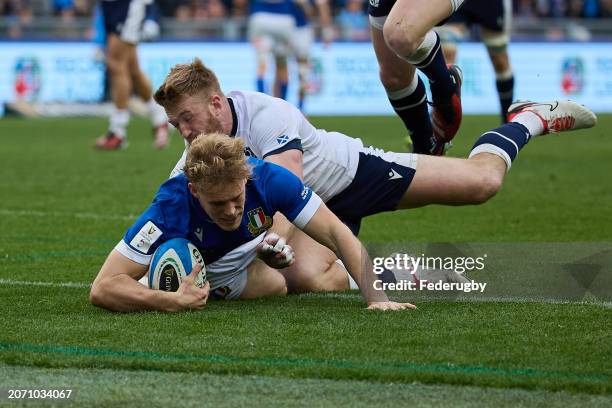 Louis Lynagh of Italy scores a try during the Guinness Six Nations 2024 match between Italy and Scotland at Stadio Olimpico on March 09, 2024 in...