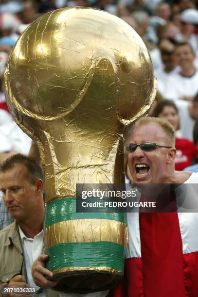 Supporter of the English team hoists a mock World Cup before the start of match 5 group F of the 2002 FIFA World Cup Korea Japan opposing England and...