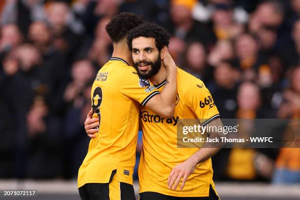 Rayan Ait-Nouri of Wolverhampton Wanderers celebrates scoring his team's first goal with teammate Joao Gomes during the Premier League match between...