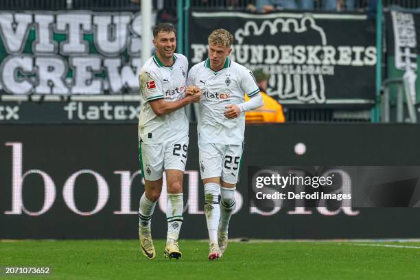 Robin Hack of Borussia Moenchengladbach celebrates after scoring his team's third goal with teammates during the Bundesliga match between Borussia...