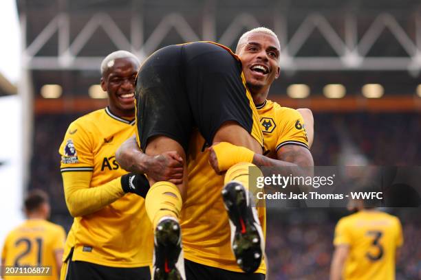 Mario Lemina and Joao Gomes of Wolverhampton Wanderers celebrate their team�’s second goal, an own-goal scored by Tom Cairney of Fulham during the...