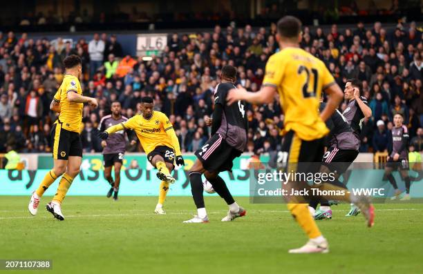 Nelson Semedo of Wolverhampton Wanderers takes a shot which is deflected by Tom Cairney of Fulham , resulting in an own-goal, the second goal for...