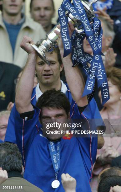 French lock Fabien Pelous raises the Six Nations rugby tournament trophy after France defeated Ireland 06 April 2002 at the Stade de France in...