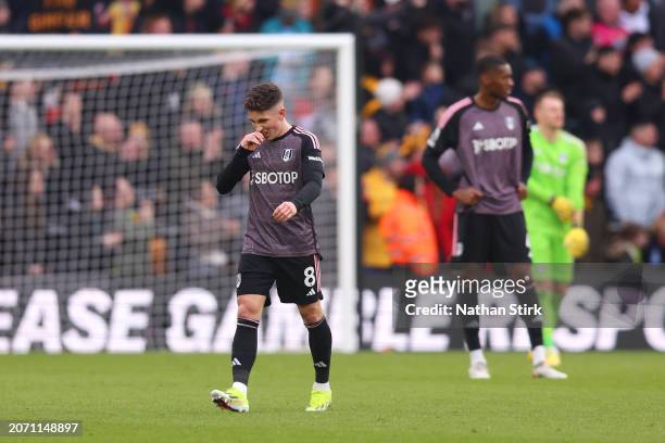 Calvin Bassey of Fulham looks dejected after teammate Tom Cairney scores an own-goal and Wolverhampton Wanderers’ second goal during the Premier...