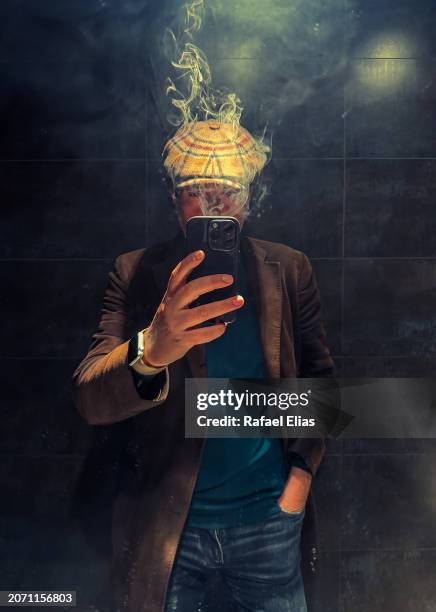 man taking selfie while exhaling smoke - burn out smoke stock pictures, royalty-free photos & images
