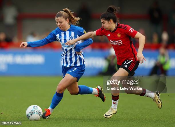 Veatriki Sarri of Brighton & Hove Albion is challenged by Lucia Garcia of Manchester United during the Adobe Women's FA Cup Quarter Final match...