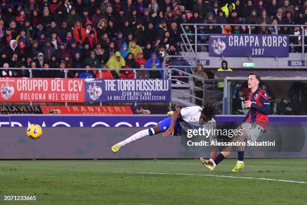 Yann Aurel Bisseck of FC Internazionale scores his team's first goal during the Serie A TIM match between Bologna FC and FC Internazionale at Stadio...