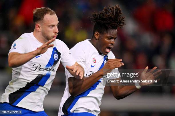 Yann Aurel Bisseck of FC Internazionale celebrates scoring his team's first goal with teammate Carlos Augusto during the Serie A TIM match between...