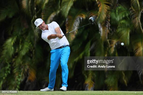 Scott Piercy of the United States plays his shot from the fourth tee during the third round of the Puerto Rico Open at Grand Reserve Golf Club on...