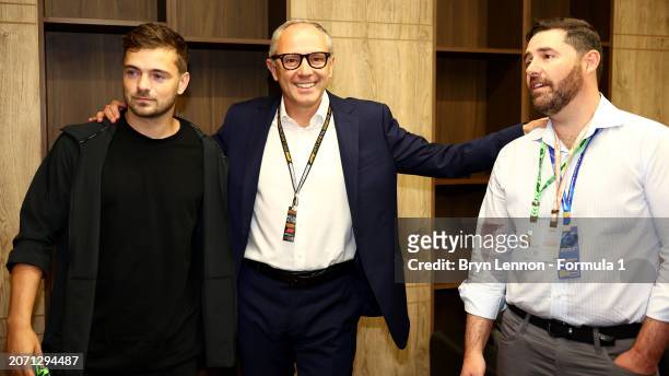 Martin Garrix, Stefano Domenicali, CEO of the Formula One Group, and Jed York, CEO of the San Francisco 49ers, pose for a photo in the Paddock prior...