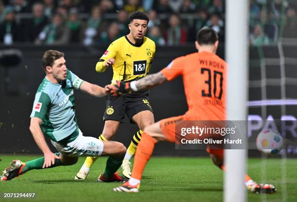 Jadon Sancho of Borussia Dortmund scores his team's second goal during the Bundesliga match between SV Werder Bremen and Borussia Dortmund at...