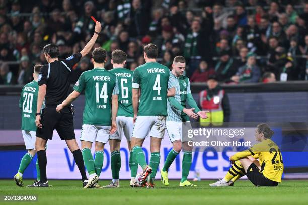 Marcel Sabitzer of Borussia Dortmund recieves a yellow card from Referee, Deniz Aytekin during the Bundesliga match between SV Werder Bremen and...
