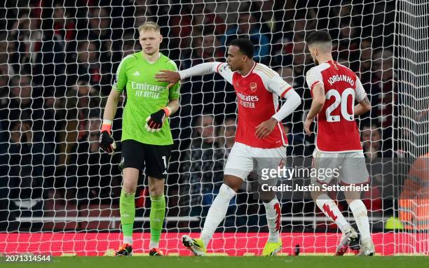 Aaron Ramsdale of Arsenal is consoled by teammate Gabriel after his mistake leads to Yoane Wissa of Brentford scoring his team's first goal during...