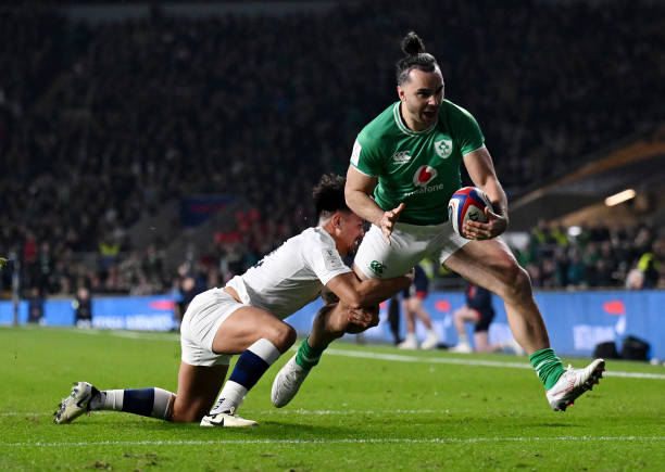 James Lowe of Ireland scores his team's second try whilst under pressure from Marcus Smith of England during the Guinness Six Nations 2024 match...