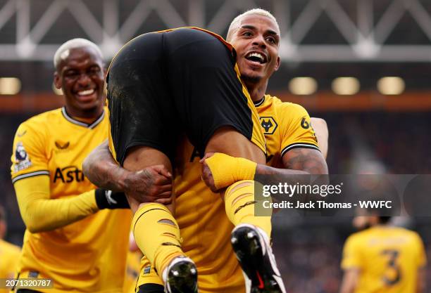 Joao Gomes and Mario Lemina of Wolverhampton Wanderers celebrate their team's second goal, assisted by Joao Gomes and scored by Nelson Semedo during...