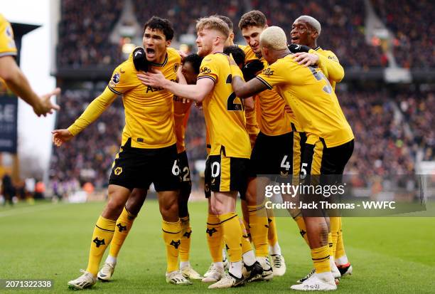 Nelson Semedo of Wolverhampton Wanderers celebrates with teammates after scoring his team's second goal during the Premier League match between...