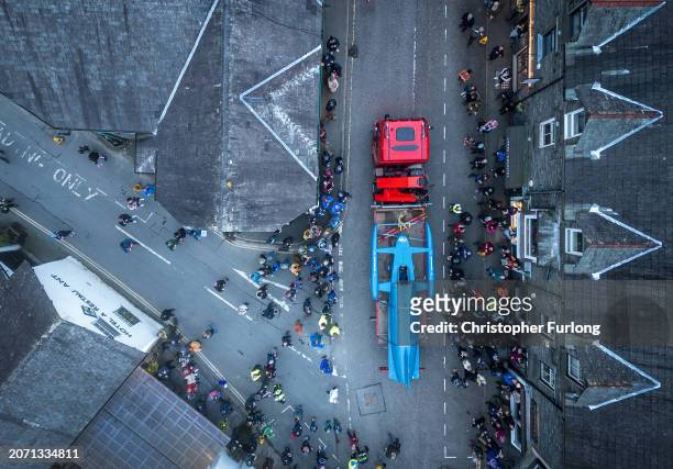 In this aerial view crowds welcome Donald Campbell's jet engine hydroplane The Bluebird K7 back to the Lake District on March 09, 2024 in Coniston,...