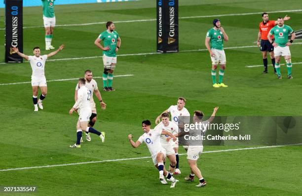 Marcus Smith of England celebrates scoring the winning drop goal during the Guinness Six Nations 2024 match between England and Ireland at Twickenham...