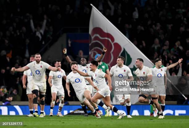 Marcus Smith of England celebrates scoring the winning drop goal as teammates celebrate behind during the Guinness Six Nations 2024 match between...