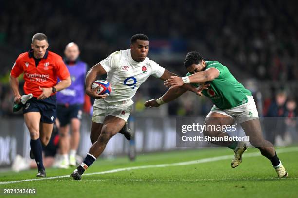 Immanuel Feyi-Waboso of England is tackled by Bundee Aki of Ireland during the Guinness Six Nations 2024 match between England and Ireland at...