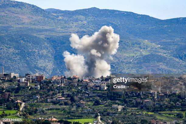 Smoke billows from the site of an Israeli airstrike that targeted the southern Lebanese village of Khiyam on March 12, 2024 amid ongoing cross-border...