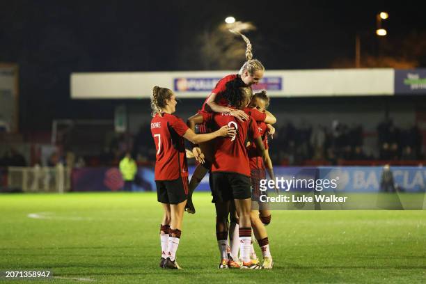 Lisa Naalsund of Manchester United celebrates scoring her team's fourth goal with teammates during the Adobe Women's FA Cup Quarter Final match...