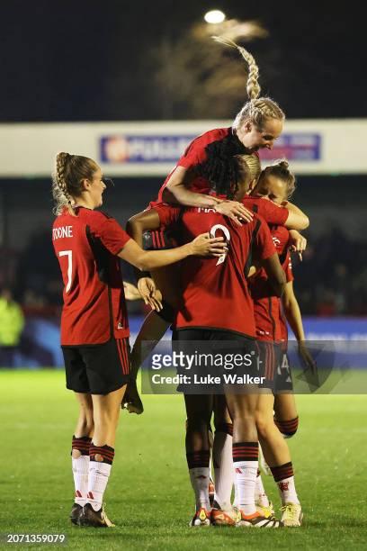 Lisa Naalsund of Manchester United celebrates scoring her team's fourth goal with teammates during the Adobe Women's FA Cup Quarter Final match...