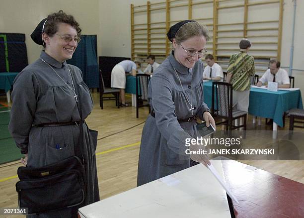 Two nuns from the Urszulanki convent, the place from which Karol Wojtyla left for the conclave to Rome to become Pope, are casting their votes in to...