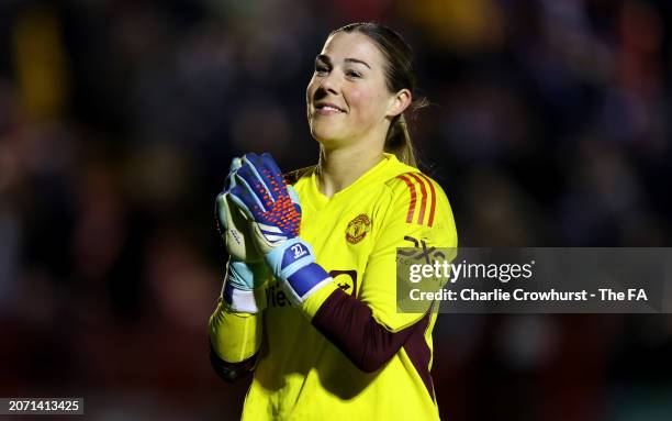 Mary Earps of Manchester United celebrates following the team's victory in the Adobe Women's FA Cup Quarter Final match between Brighton & Hove...