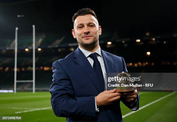 Danny Care of England poses for a photograph with his Gold Cap Trophy, after making his 100th Cap Appearance for England during their victory over...