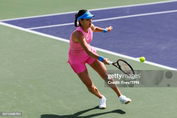 Emma Raducanu of Great Britain hits a forehand against Dayana Yastremska of Russia in the second round of the BNP Paribas Masters at Indian Wells...