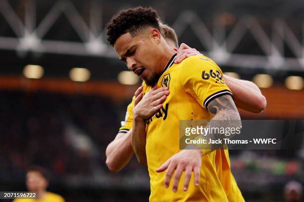 Joao Gomes of Wolverhampton Wanderers celebrates assisting his team's second goal scored by Nelson Semedo during the Premier League match between...