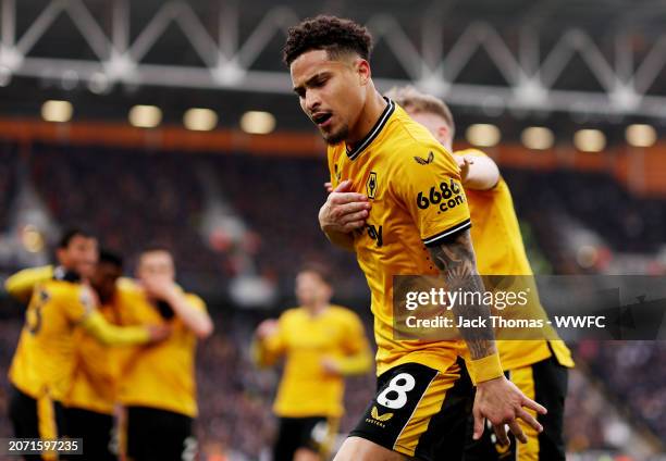 Joao Gomes of Wolverhampton Wanderers celebrates assisting his team's second goal scored by Nelson Semedo during the Premier League match between...