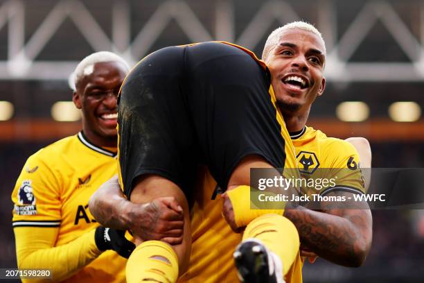 Joao Gomes and Mario Lemina of Wolverhampton Wanderers celebrate their team's second goal, assisted by Joao Gomes and scored by Nelson Semedo during...