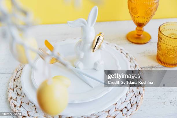 table place setting with bunny figure and eggs - easter religious stock pictures, royalty-free photos & images