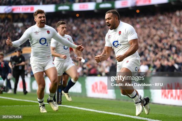 Ollie Lawrence of England celebrates scoring his teams 1st try with Henry Slade during the Guinness Six Nations 2024 match between England and...