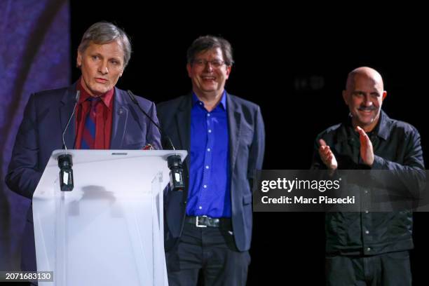 Actor and director Viggo Mortensen receives the Tribute award from Director Gaspar Noe and journalist Philippe Rouyer during the Closing Ceremony...